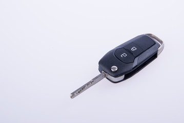 key or car key with remote on background.