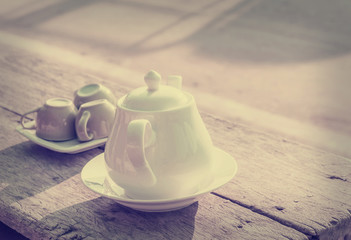 Pitchers and cups on wood, vintage filters.
