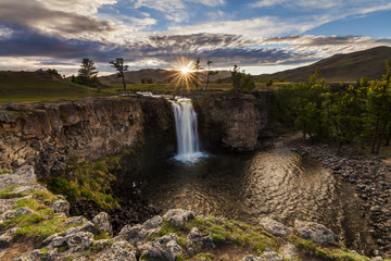 Landscape with a view of the waterfall and beautiful sky. Mongol