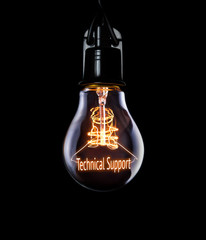 Hanging lightbulb with glowing Technical Support concept.