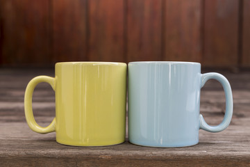Closeup ceramic coffee mug on wood background