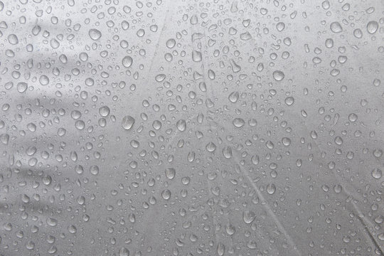 Rain drop on grey plastic background