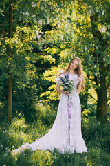 stylish boho bride holding rustic bouquet of amazing flowers