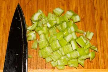 pepper, knife and cutting board