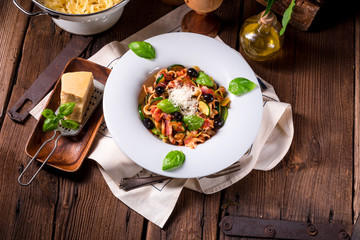 Ribbon Pasta with zucchini and olives in tomato sauce
