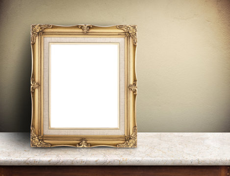 Blank Gold Victorian Picture Frame On Marble Table At Yellow Con