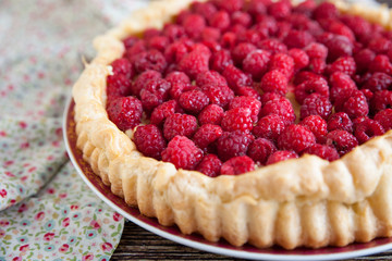 Cake eclair with raspberry