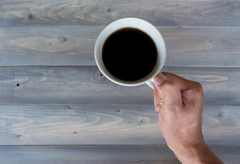 hand holding coffee cup