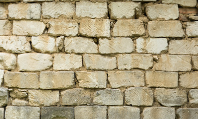 background wall of stone blocks