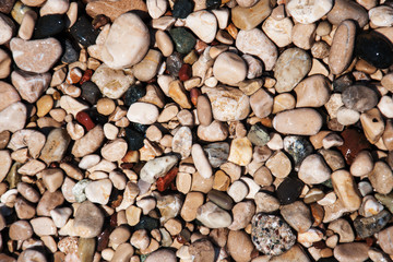 stones on beach and sea water