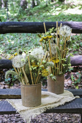 Bouquet with autumn flowers and plants in ceramic pots