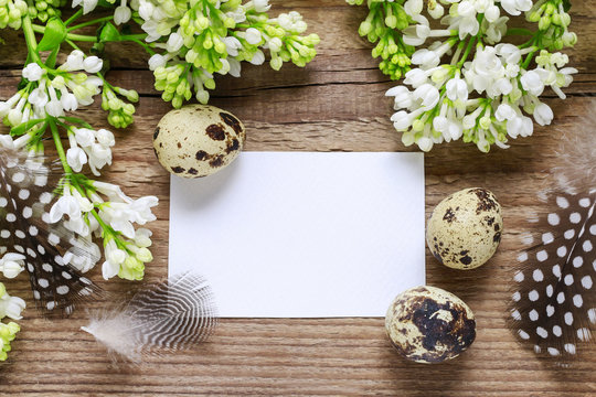 White lilacs on wooden background