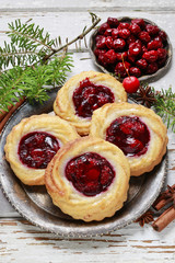 Round marzipan cookies with cherry jam