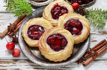 Round marzipan cookies with cherry jam