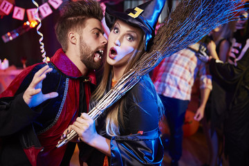 Obraz na płótnie Canvas Vampire and witch at Halloween party