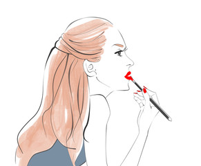 紅筆で口紅を塗る女性