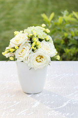 Floral arrangement with yellow roses