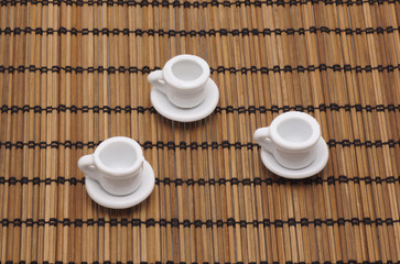 Toy dishes on a napkin from a bamboo.