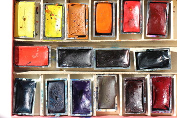 Set of watercolor paints and paintbrushes