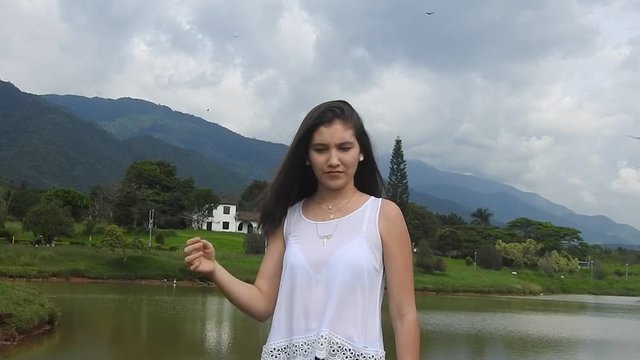 Teen Girl Standing Near Lake