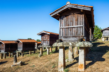 Fototapeta na wymiar Horreos (granaries) of A Merca, the highest concentration of horreos in Galicia (Spain)