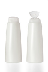 Plastic bottles of shampoo isolated on white background