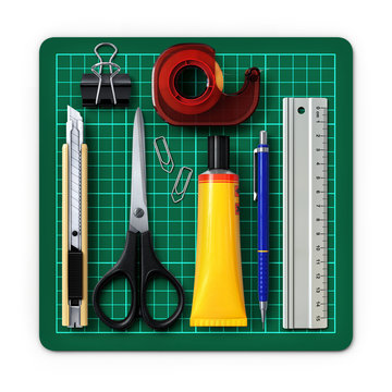 Office stationery tools.Organized on a cutting mat.3D rendering.Top view.