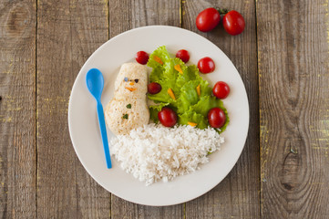 Snowman chichken cutlet with rice and salad tree with  cherry to