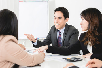 Asian business people at the meeting