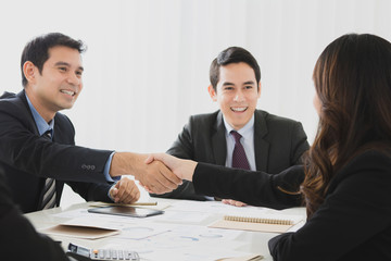 Businesspeople making handshake in the meeting