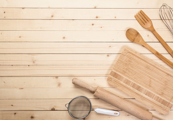 Various wooden kitchen utensils on table top view