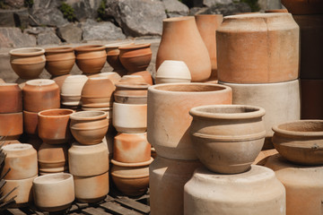 Fototapeta na wymiar Huge roasted ceramic pots without glaze storage