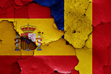 flags of Spain and Romania painted on cracked wall