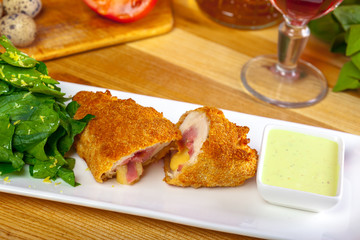 Breaded cutlet served on a plate