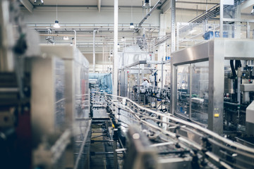 Industrial interiors. Robotic factory line for processing and quality control of pure spring water...