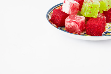 Sweet pieces of turkish delight isolated on white background

