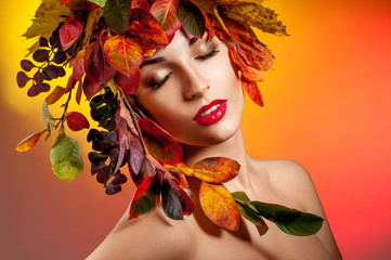 Autumn Woman Fashion Portrait. Beautiful Model Girl with colourf