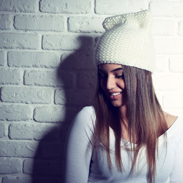 Portrait of young attractive cheerful hipster girl making funny