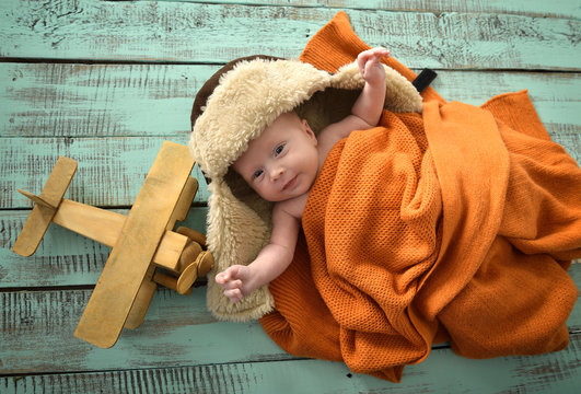 Baby boy aviator with pilot scarf and hat and handmade toy airpl