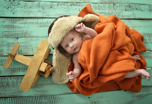 Baby boy aviator with pilot scarf and hat and handmade toy airpl