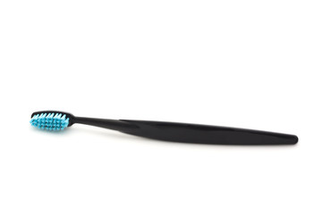 Black toothbrush on white background