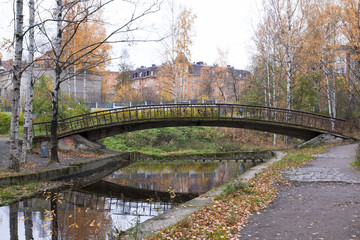 Fototapeta na wymiar Old bridge in autumn, Petrozavodsk, Karelia