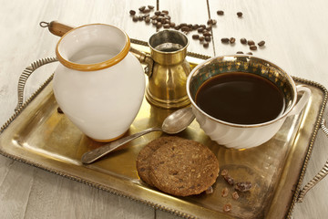 Vintage tray with coffee, oatmeal cookies, and milk