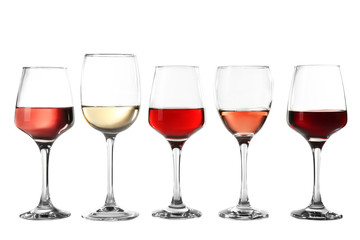 Glasses with different wine in a row, isolated on white