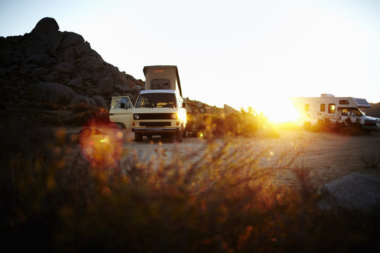 A camper van, a classic design, and an iconic travelling vehicle in Yosemite national park, at sunset. 