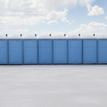 Row of portable toilets on salt flats, during Speed Week