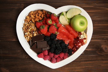 Healthy food on wooden table. Heart health concept © Africa Studio