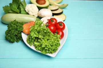 Healthy food on wooden table. Heart health concept