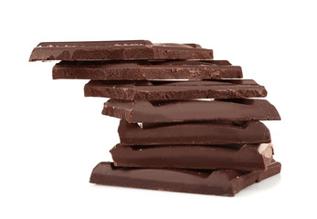 Pile of dark chocolate tiles isolated on white