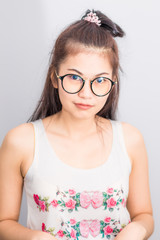 Happy asian young  student woman wear glasses at home